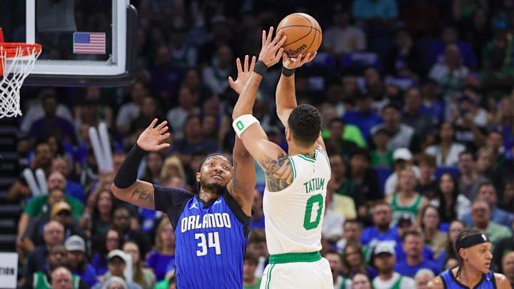 Boston Celtics forward Jayson Tatum (0) shoots against Orlando Magic center Wendell Carter Jr. (34) during the first quarter of game three of first round for the 2024 NBA Playoffs at Kia Center.