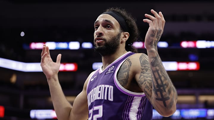 Feb 19, 2026; Sacramento, California, USA; Sacramento Kings guard Devin Carter (22) gestures to the Orlando Magic bench to acknowledge the foul he committed during the third quarter at Golden 1 Center. Mandatory Credit: Kelley L Cox-Imagn Images