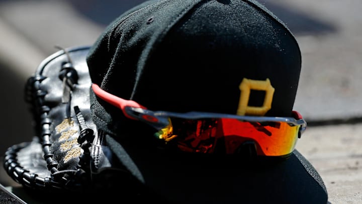 Apr 23, 2022; Chicago, Illinois, USA; A detail view of the glove, hat, and sunglasses of Pittsburgh