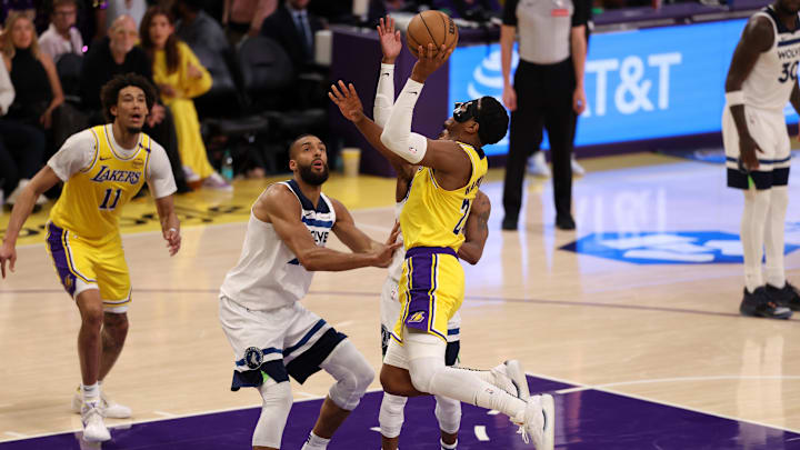Apr 22, 2025; Los Angeles, California, USA; Los Angeles Lakers forward Rui Hachimura (28) goes to the basket against Minnesota Timberwolves center Rudy Gobert (27) during the third quarter of game two of first round for the 2024 NBA Playoffs at Crypto.com Arena. Mandatory Credit: Kiyoshi Mio-Imagn Images