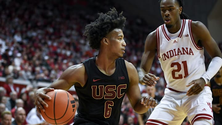 Jan 8, 2025; Bloomington, Indiana, USA; USC Trojans guard Wesley Yates III (6) goes to the basket against Indiana Hoosiers forward Mackenzie Mgbako (21) during the second half at Simon Skjodt Assembly Hall. Jan 8, 2025; Bloomington, Indiana, USA; USC Trojans guard Wesley Yates III (6) goes to the basket against Indiana Hoosiers forward Mackenzie Mgbako (21) during the second half at Simon Skjodt Assembly Hall.