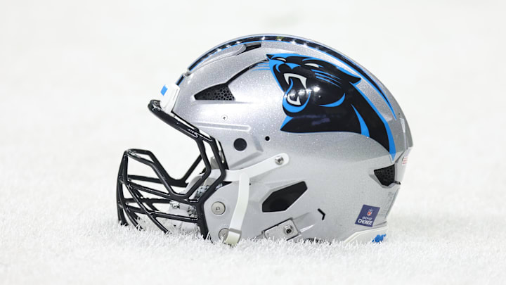 Dec 14, 2025; New Orleans, Louisiana, USA; Detailed shot of a Carolina Panthers helmet on the grass before the game against the New Orleans Saints at Caesars Superdome. Mandatory Credit: Stephen Lew-Imagn Images