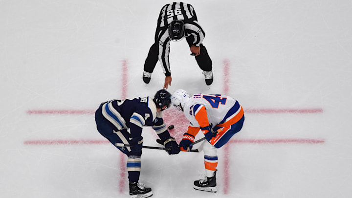 Blue Jackets center Cole Sillinger faces off against Islanders center JG Pageau. Blue Jackets center Cole Sillinger faces off against Islanders center JG Pageau.