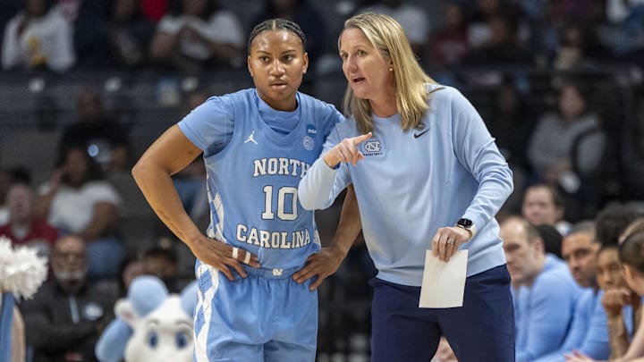 Mar 28, 2025; Birmingham, AL, USA; North Carolina Tar Heels head coach Courtney Banghart works with guard Reniya Kelly (10) during the Sweet 16 NCAA Tournament basketball game against the Duke Blue Devils at Legacy Arena. Mandatory Credit: Vasha Hunt-Imagn Images Mar 28, 2025; Birmingham, AL, USA; North Carolina Tar Heels head coach Courtney Banghart works with guard Reniya Kelly (10) during the Sweet 16 NCAA Tournament basketball game against the Duke Blue Devils at Legacy Arena. Mandatory Credit: Vasha Hunt-Imagn Images