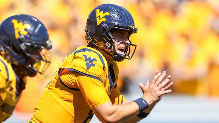 Aug 30, 2025; Morgantown, West Virginia, USA; West Virginia Mountaineers quarterback Nicco Marchiol (8) pauses before a snap during the first quarter against the Robert Morris Colonials at Milan Puskar Stadium. Mandatory Credit: Ben Queen-Imagn Images