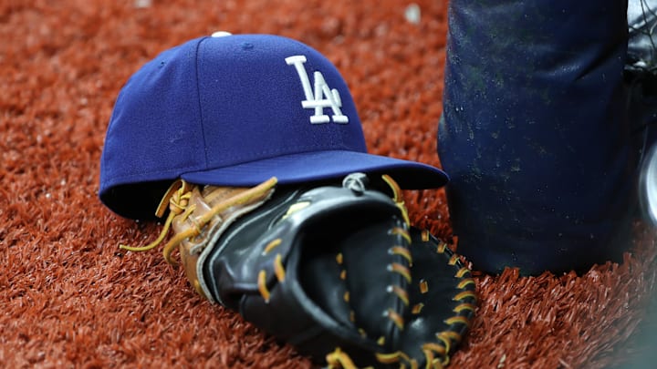 May 21, 2019; St. Petersburg, FL, USA; A detail view of Los Angeles Dodgers hat and glove at May 21, 2019; St. Petersburg, FL, USA; A detail view of Los Angeles Dodgers hat and glove at
