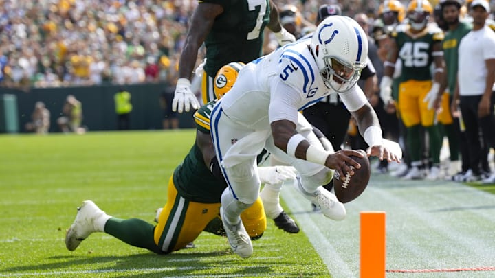 Sep 15, 2024; Green Bay, Wisconsin, USA;  Indianapolis Colts quarterback Anthony Richardson (5) dives to earn a first down during the fourth quarter against the Green Bay Packers at Lambeau Field. Mandatory Credit: Jeff Hanisch-Imagn Images