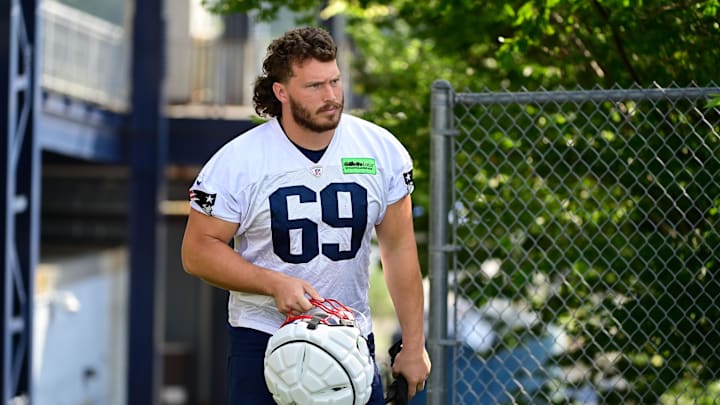 Jul 26, 2023; Foxborough, MA, USA; New England Patriots guard Cole Strange (69) makes his way to the practice fields for  training camp at Gillette Stadium. Mandatory Credit: Eric Canha-Imagn Images
