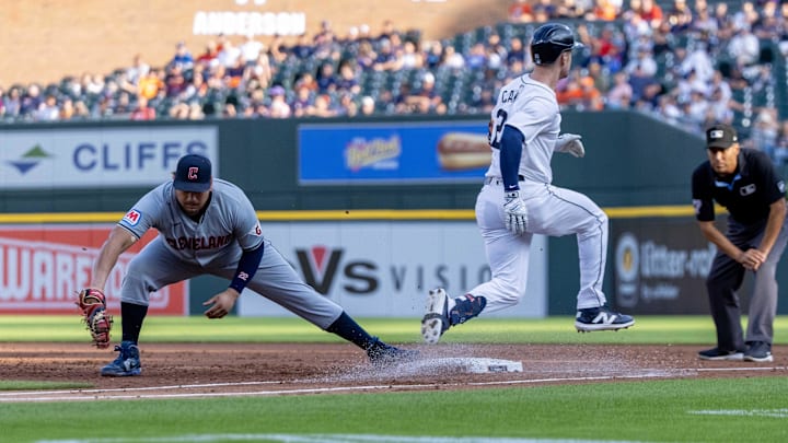 Jul 29, 2024; Detroit, Michigan, USA; Cleveland Guardians first baseman Josh Naylor (22) catches the ball as Detroit Tigers first baseman Mark Canha (21) is out to end the first inning at Comerica Park. Mandatory Credit: David Reginek-Imagn Images