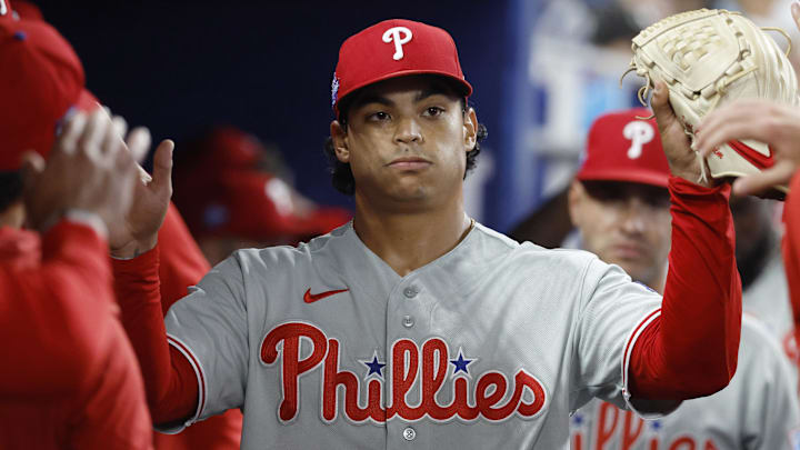 May 3, 2026; Miami, Florida, USA;  Philadelphia Phillies starting pitcher Jesus Luzardo (44) is congratulated by teammates in the dugout against the Miami Marlins during the seventh inning at loanDepot Park. 