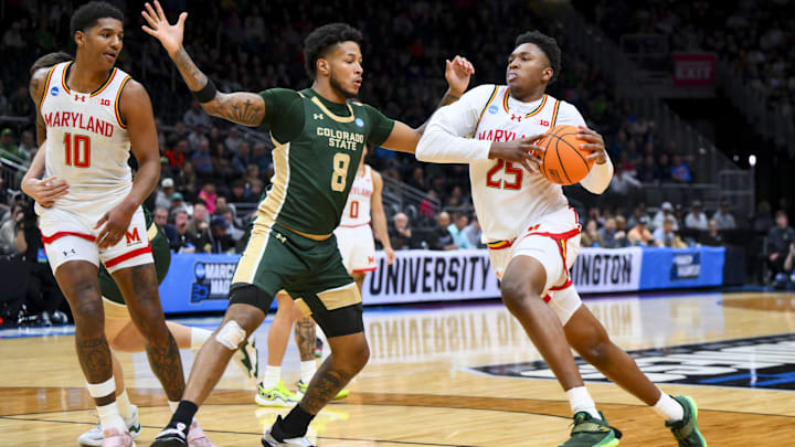 Mar 23, 2025; Seattle, WA, USA; Maryland Terrapins center Derik Queen (25) drives to the basket against Colorado State Rams forward Jaylen Crocker-Johnson (8) in the first half at Climate Pledge Arena. Mandatory Credit: Steven Bisig-Imagn Images