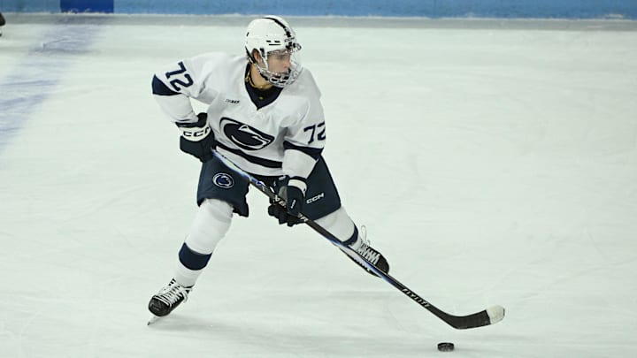 Penn State Nittany Lions forward Gavin McKenna controls the puck in the first period of a game against the Clarkson Golden Knights at Pegula Ice Arena. 