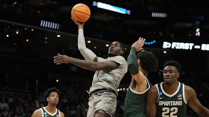 March 21, 2024, Charlotte, NC, USA; Mississippi State Bulldogs forward Cameron Matthews (4) shoots against the Michigan State Spartans in the first round of the 2024 NCAA Tournament at the Spectrum Center. Mandatory Credit: Bob Donnan-Imagn Images