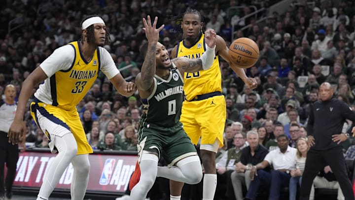 Apr 25, 2025; Milwaukee, Wisconsin, USA; Milwaukee Bucks guard Damian Lillard (0) drives to the basket gains Indiana Pacers center Myles Turner (33) and forward Aaron Nesmith (23) in the second half during game three of first round for the 2024 NBA Playoffs at Fiserv Forum. Mandatory Credit: Michael McLoone-Imagn Images Apr 25, 2025; Milwaukee, Wisconsin, USA; Milwaukee Bucks guard Damian Lillard (0) drives to the basket gains Indiana Pacers center Myles Turner (33) and forward Aaron Nesmith (23) in the second half during game three of first round for the 2024 NBA Playoffs at Fiserv Forum. Mandatory Credit: Michael McLoone-Imagn Images
