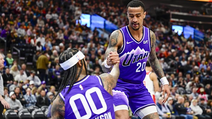 Mar 4, 2024; Salt Lake City, Utah, USA; Utah Jazz forward/center John Collins (20) helps guard