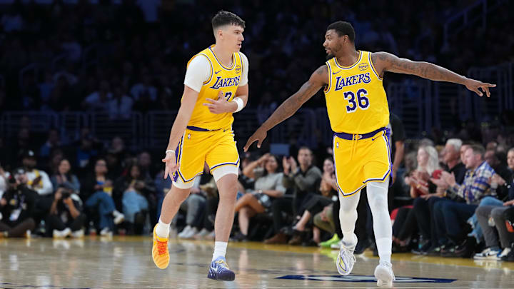 Oct 24, 2025; Los Angeles, California, USA; Los Angeles Lakers forward Jake LaRavia (12) celebrates with guard Marcus Smart (36) after a three-point basket in the first half against the Minnesota Timberwolves at Crypto.com Arena. Mandatory Credit: Kirby Lee-Imagn Images Oct 24, 2025; Los Angeles, California, USA; Los Angeles Lakers forward Jake LaRavia (12) celebrates with guard Marcus Smart (36) after a three-point basket in the first half against the Minnesota Timberwolves at Crypto.com Arena. Mandatory Credit: Kirby Lee-Imagn Images