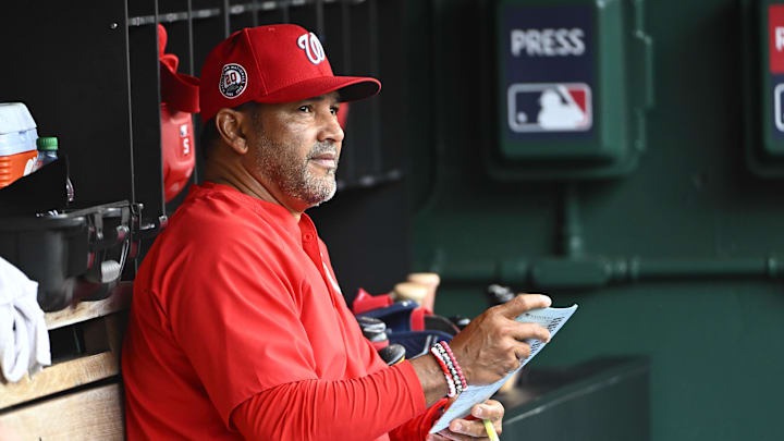 Jun 8, 2025; Washington, District of Columbia, USA; Washington Nationals manager Dave Martinez (4) in the dugout against the Texas Rangers at Nationals Park. 