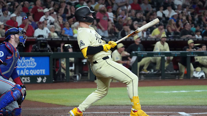 Sep 10, 2024; Phoenix, Arizona, USA; Arizona Diamondbacks designated hitter Joc Pederson (3) hits a solo home run against the Texas Rangers in the first inning at Chase Field. 