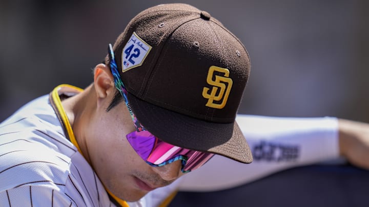Apr 15, 2023; San Diego, California, USA;  San Diego Padres second baseman Ha-Seong Kim wears a hat with the Jackie Robinson commemorative logo during the game against the Milwaukee Brewers at Petco Park. Mandatory Credit: Ray Acevedo-Imagn Images