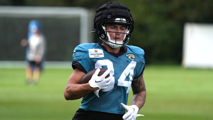 Oct 17, 2024; Watford, United Kingdom; Jacksonville Jaguars wide receiver Louis Rees-Zammit (84) wears a Guardian helmet cap during practice at The Grove. Mandatory Credit: Kirby Lee-Imagn Images Oct 17, 2024; Watford, United Kingdom; Jacksonville Jaguars wide receiver Louis Rees-Zammit (84) wears a Guardian helmet cap during practice at The Grove. Mandatory Credit: Kirby Lee-Imagn Images