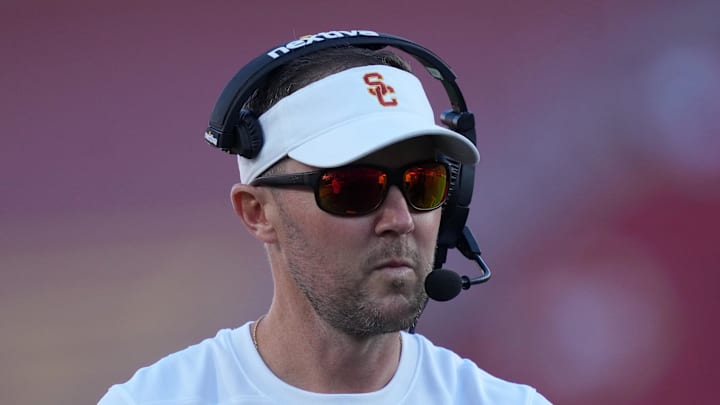 Oct 21, 2023; Los Angeles, California, USA; Southern California Trojans head coach Lincoln Riley watches from the sidelines against the Utah Utes in the first half at United Airlines Field at Los Angeles Memorial Coliseum. Mandatory Credit: Kirby Lee-Imagn Images Oct 21, 2023; Los Angeles, California, USA; Southern California Trojans head coach Lincoln Riley watches from the sidelines against the Utah Utes in the first half at United Airlines Field at Los Angeles Memorial Coliseum. Mandatory Credit: Kirby Lee-Imagn Images