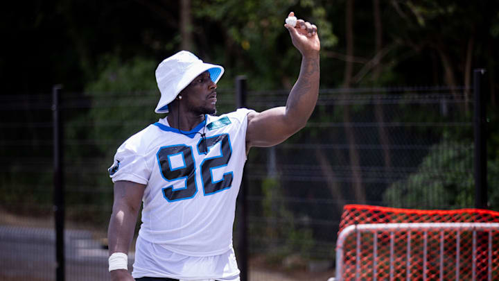 Jul 24, 2025; Charlotte, NC, USA; Carolina Panthers defensive tackle Tershawn Wharton (92) plays around as he waits to be interviewed during training camp. Mandatory Credit: Scott Kinser-Imagn Images