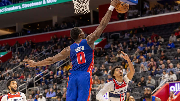 Mar 11, 2025; Detroit, Michigan, USA; Detroit Pistons center Jalen Duren (0) blocks a shot from Washington Wizards guard Jordan Poole (13) during the first half at Little Caesars Arena. Mandatory Credit: David Reginek-Imagn Images