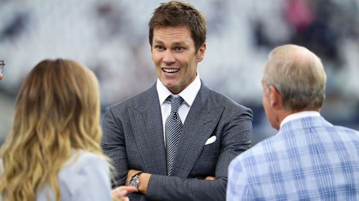 Tom Brady speaks to colleagues Erin Andrews and Tom Rinaldi before a game in Dallas.