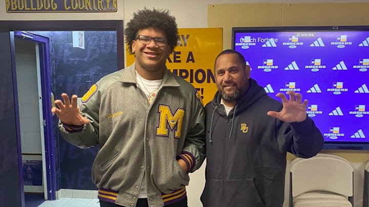 Inoke Breckterfield, former UW defensive-line coach, is shown with recruit Pulelei'ite Primus. Inoke Breckterfield, former UW defensive-line coach, is shown with recruit Pulelei'ite Primus.
