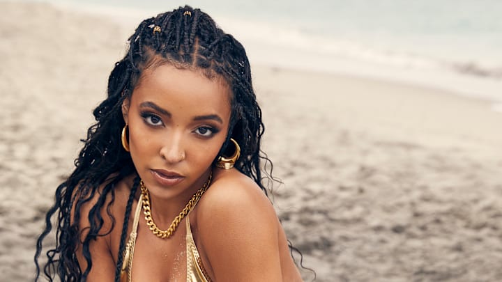 Tinashe was photographed by James Macari in Hollywood, Fla. Swimsuit by Lisa Marie Fernandez. Earrings and rings by Lili Claspe. Necklace by Aureum. Tinashe was photographed by James Macari in Hollywood, Fla. Swimsuit by Lisa Marie Fernandez. Earrings and rings by Lili Claspe. Necklace by Aureum.