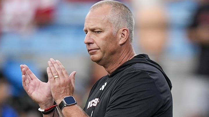 Sep 7, 2024; Charlotte, North Carolina, USA; North Carolina State Wolfpack head coach Dave Doeren during pregame activities against the Tennessee Volunteers at the Dukes Mayo Classic at Bank of America Stadium. Mandatory Credit: Jim Dedmon-Imagn Images Sep 7, 2024; Charlotte, North Carolina, USA; North Carolina State Wolfpack head coach Dave Doeren during pregame activities against the Tennessee Volunteers at the Dukes Mayo Classic at Bank of America Stadium. Mandatory Credit: Jim Dedmon-Imagn Images