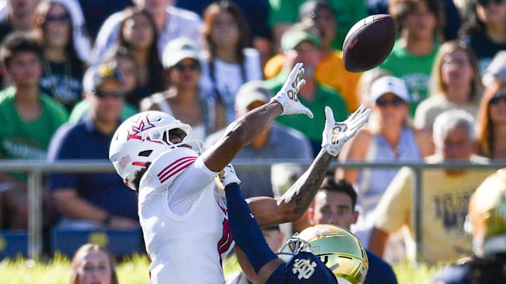 Sep 21, 2024; South Bend, Indiana, USA; Notre Dame Fighting Irish cornerback Jaden Mickey (7) breaks up a pass intended for Miami Redhawks wide receiver Reggie Virgil (0) in the second quarter at Notre Dame Stadium. Mandatory Credit: Matt Cashore-Imagn Images
