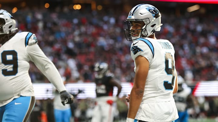 Nov 16, 2025; Atlanta, Georgia, USA; Carolina Panthers quarterback Bryce Young (9) reacts to a touchdown in the fourth quarter against the Atlanta Falcons at Mercedes-Benz Stadium. 