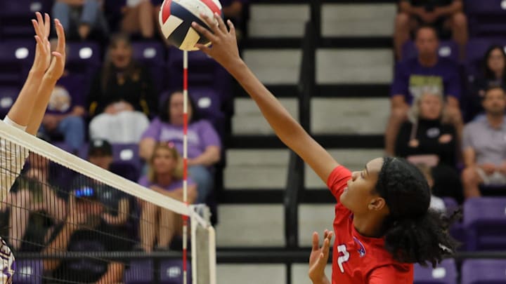 Makayla White (8) hits a point at the net for Hays in district play against Liberty Hill Sept. 27 at Liberty Hill High School. Host Liberty Hill swept the match in straight sets over Hays, 3-0.
