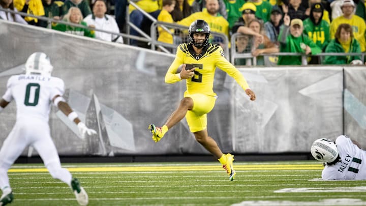 Oregon Ducks quarterback Dante Moore runs the ball as the Ducks host the Spartans Friday, Oct. 4, 2024 at Autzen Stadium in Eugene, Ore.