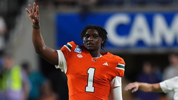 Dec 28, 2024; Orlando, FL, USA; Miami Hurricanes quarterback Cam Ward (1) gestures during the second half against the Iowa State Cyclones  at Camping World Stadium. 