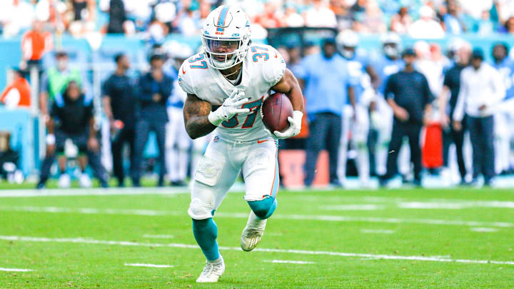 Nov 28, 2021; Miami Gardens, Florida, USA; Miami Dolphins running back Myles Gaskin (37) runs with the football against the Carolina Panthers during the third quarter at Hard Rock Stadium. Mandatory Credit: Sam Navarro-Imagn Images