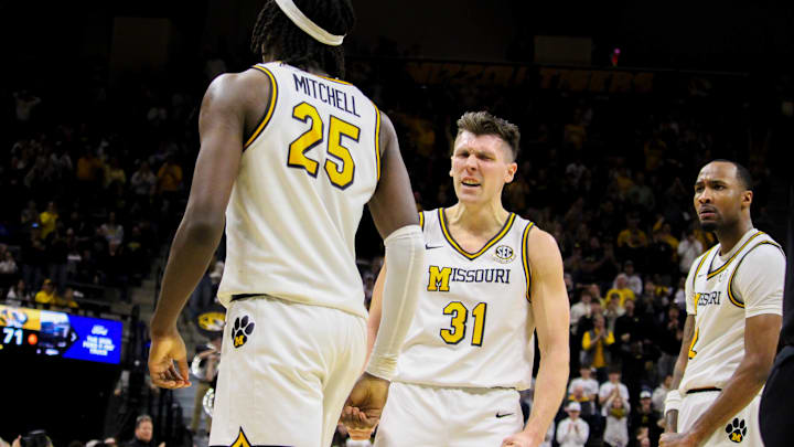 Jan 11, 2025; Columbia, Missouri, USA; Missouri Tigers guards Caleb Grill (31) and Tamar Bates (2) celebrate with forward Mark Mitchell (25) during a game against the Vanderbilt Commodores at Mizzou Arena. Jan 11, 2025; Columbia, Missouri, USA; Missouri Tigers guards Caleb Grill (31) and Tamar Bates (2) celebrate with forward Mark Mitchell (25) during a game against the Vanderbilt Commodores at Mizzou Arena.