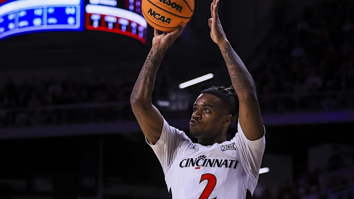 Feb 8, 2025; Cincinnati, Ohio, USA; Cincinnati Bearcats guard Jizzle James (2) shoots against the Brigham Young Cougars in the first half at Fifth Third Arena. Mandatory Credit: Katie Stratman-Imagn Images