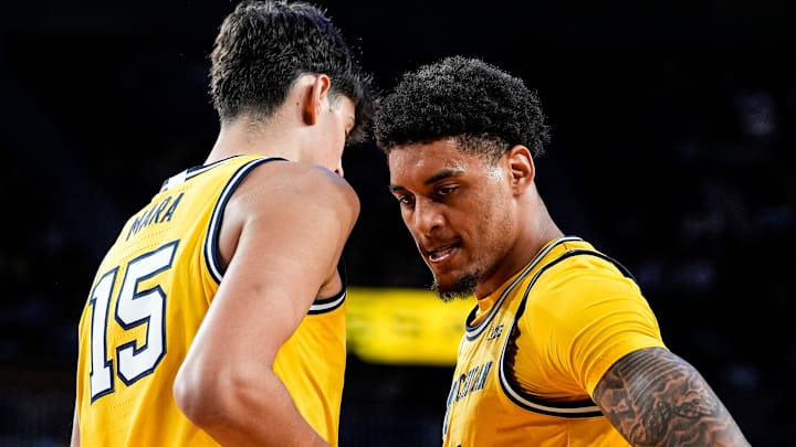 Michigan forward Yaxel Lendeborg (23) celebrates a play against Middle Tennessee with center Aday Mara (15) during the second half at Crisler Center in Ann Arbor on Wednesday, November 19, 2025.