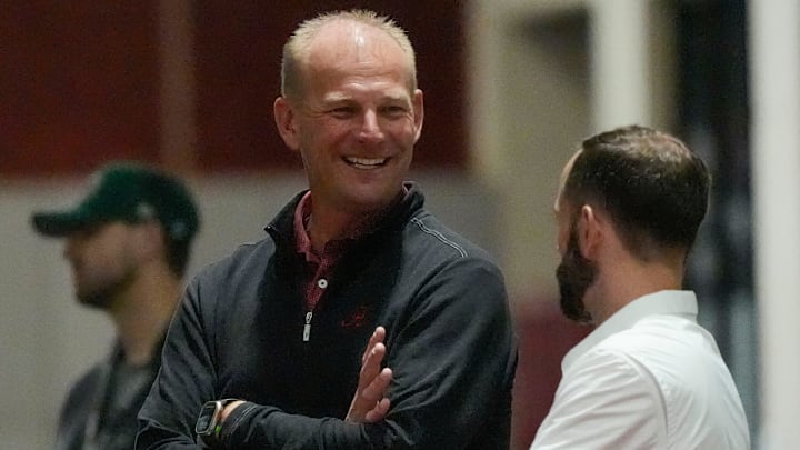 Mar 19, 2025; Tuscaloosa AL, USA; Alabama head caoch Kalen DeBoer watches the workouts at the University of Alabama Pro Day as several Crimson Tide players worked out for NFL teams in the Hank Crisp Indoor Practice Facility.