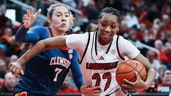 Louisville's Tajianna Roberts (22) worked against Clemson's Summah Evans (7) during their game at the KFC Yum! Center in Louisville, Ky. on Feb. 27, 2025.