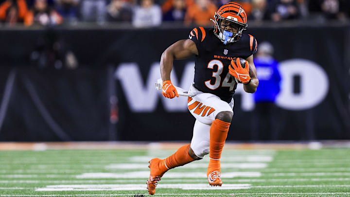 Dec 28, 2024; Cincinnati, Ohio, USA; Cincinnati Bengals running back Khalil Herbert (34) runs with the ball against the Denver Broncos in overtime at Paycor Stadium. Mandatory Credit: Katie Stratman-Imagn Images
