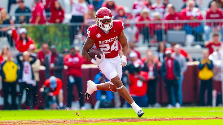 Oklahoma Sooners running back Xavier Robinson (24) runs with the ball during the second half against the Ole Miss Rebels at Gaylord Family-Oklahoma Memorial Stadium on Saturday. Oklahoma Sooners running back Xavier Robinson (24) runs with the ball during the second half against the Ole Miss Rebels at Gaylord Family-Oklahoma Memorial Stadium on Saturday.