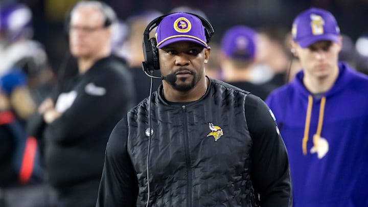 Jan 13, 2025; Glendale, AZ, USA; Minnesota Vikings defensive coordinator Brian Flores against the Los Angeles Rams during an NFC wild card game at State Farm Stadium. Mandatory Credit: Mark J. Rebilas-Imagn Images Jan 13, 2025; Glendale, AZ, USA; Minnesota Vikings defensive coordinator Brian Flores against the Los Angeles Rams during an NFC wild card game at State Farm Stadium. Mandatory Credit: Mark J. Rebilas-Imagn Images