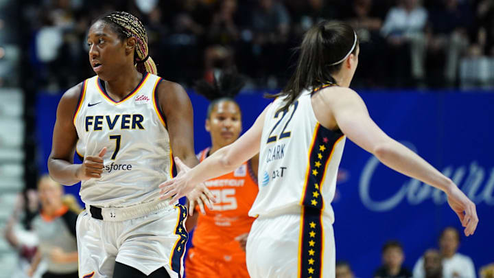 Jun 10, 2024; Uncasville, Connecticut, USA; Indiana Fever forward Aliyah Boston (7) and guard Caitlin Clark (22) react after a basket against the Connecticut Sun in the first quarter at Mohegan Sun Arena. Mandatory Credit: David Butler II-Imagn Images Jun 10, 2024; Uncasville, Connecticut, USA; Indiana Fever forward Aliyah Boston (7) and guard Caitlin Clark (22) react after a basket against the Connecticut Sun in the first quarter at Mohegan Sun Arena. Mandatory Credit: David Butler II-Imagn Images
