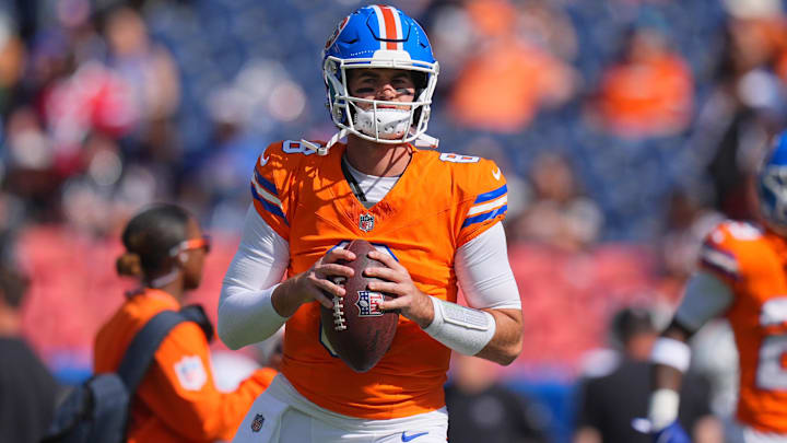 Oct 6, 2024; Denver, Colorado, USA; Denver Broncos quarterback Jarrett Stidham (8) warms up before the game against the Las Vegas Raiders at Empower Field at Mile High. 
