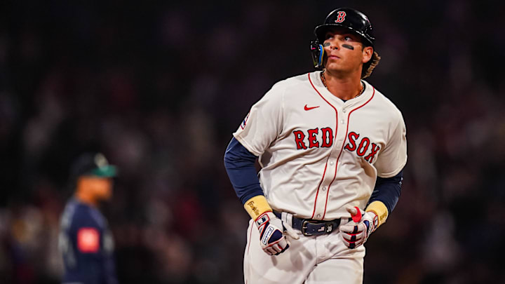 Apr 22, 2025; Boston, Massachusetts, USA; Boston Red Sox first base Triston Casas (36) hits a three run home run against the Seattle Mariners in the seventh inning at Fenway Park. 