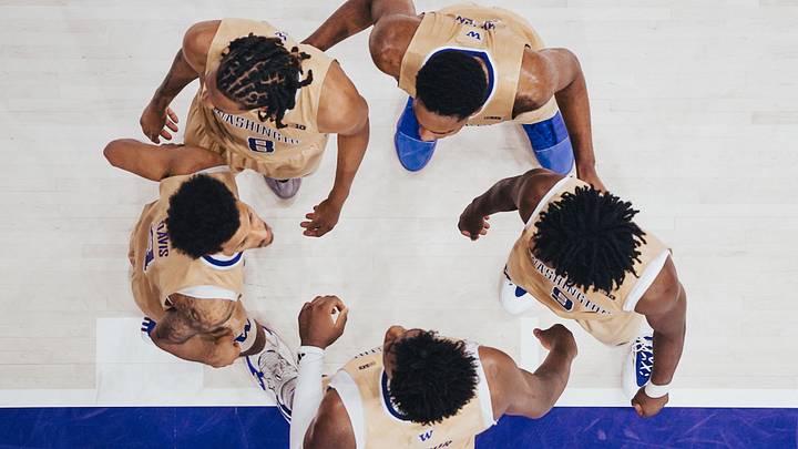 The Huskies gather before plays resumes at Alaska Airlines Arena. The Huskies gather before plays resumes at Alaska Airlines Arena.