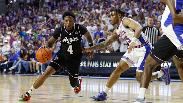 Mar 1, 2025; Gainesville, Florida, USA; Texas A&M Aggies guard Wade Taylor IV (4) dribbles the ball around Florida Gators guard Alijah Martin (15) during the first half at Exactech Arena at the Stephen C. O'Connell Center. Mandatory Credit: Morgan Tencza-Imagn Images Mar 1, 2025; Gainesville, Florida, USA; Texas A&M Aggies guard Wade Taylor IV (4) dribbles the ball around Florida Gators guard Alijah Martin (15) during the first half at Exactech Arena at the Stephen C. O'Connell Center. Mandatory Credit: Morgan Tencza-Imagn Images